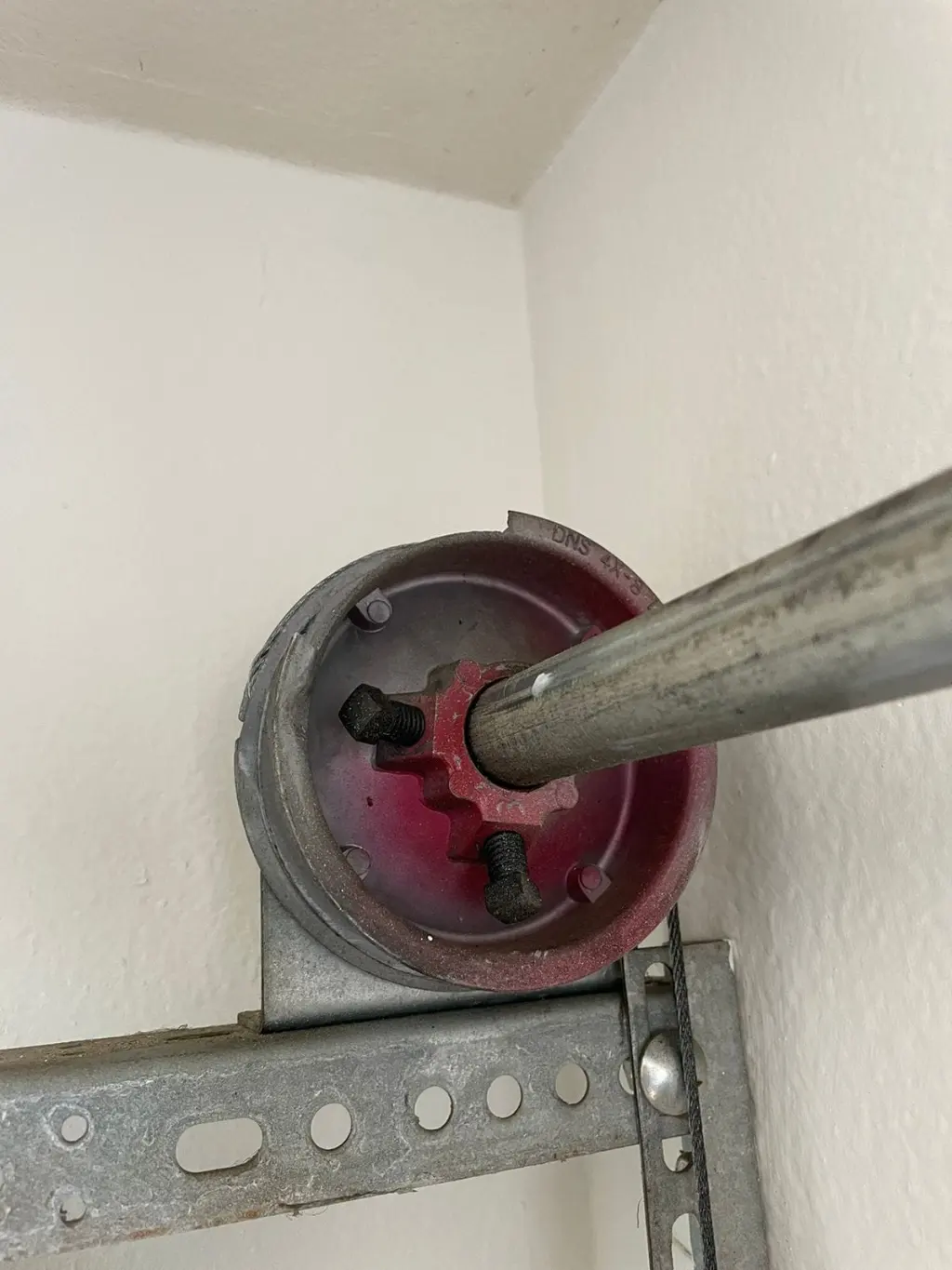 Garage door cable and torsion shaft assembly