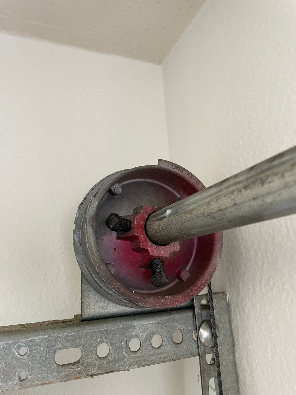 Garage door cable and torsion shaft assembly