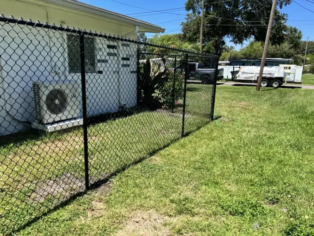 Black chain link side-yard fence