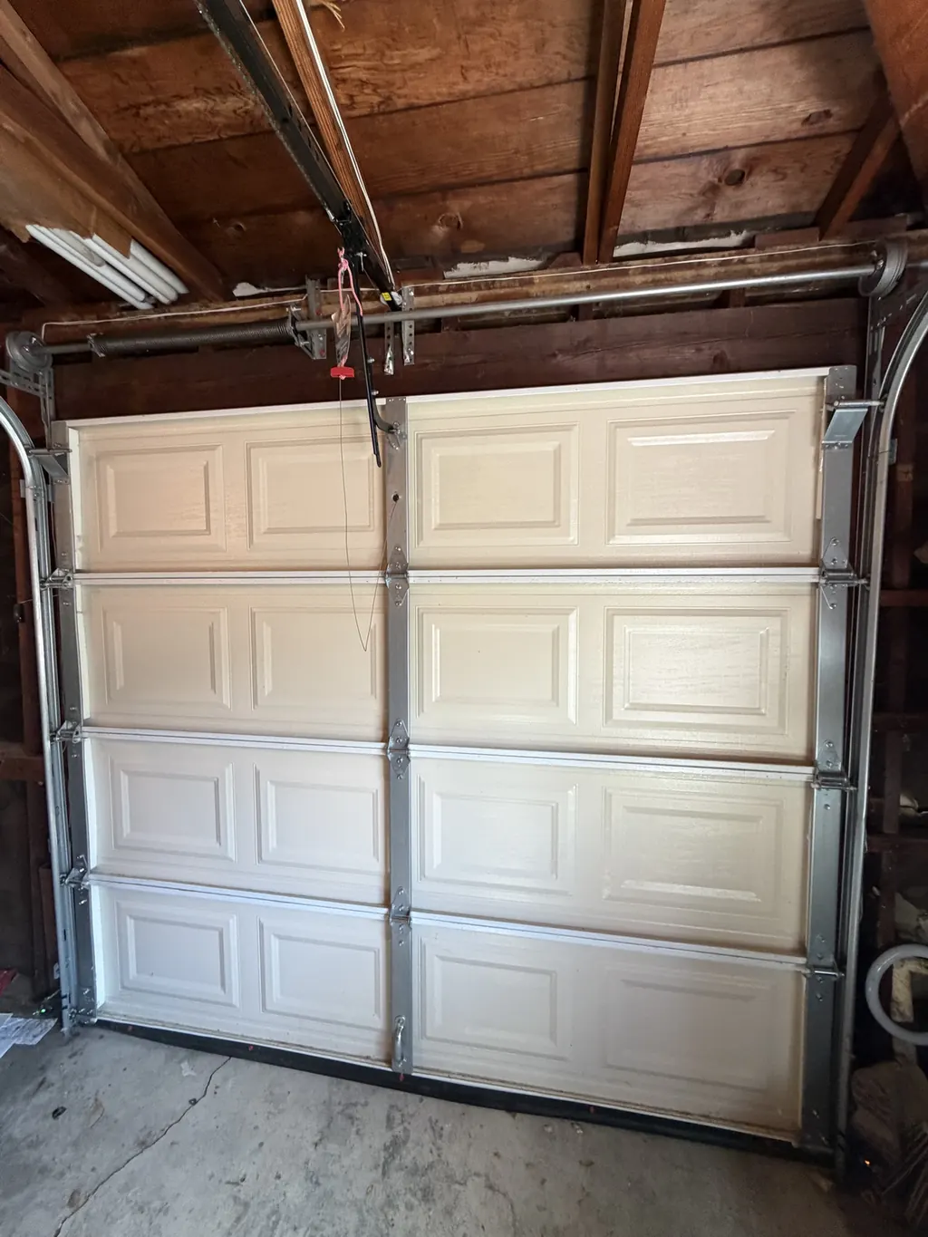 Single garage door closed and running smoothly after repair