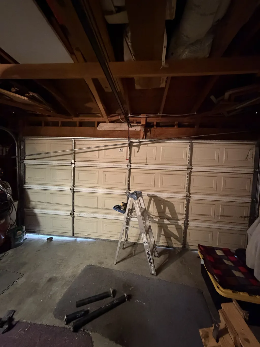 Torsion spring replacement on a double garage door, mid-job